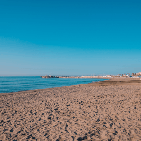 Soak up the sun on the sands of Playa de Carvajal, a short drive away