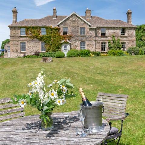 Enjoy an afternoon tipple amidst the fresh country air in the vast gardens