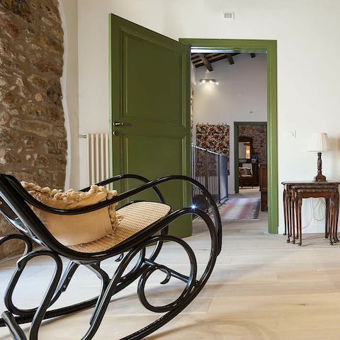 Relax in the stylish rocking chair with your favourite novel