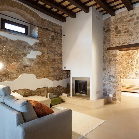 Admire striking original features like timber beams and exposed brickwork