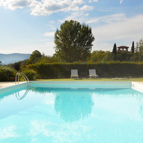 Soak up the sun from the poolside sun loungers