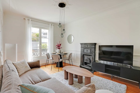 Plan your Parisian days from this light-filled living area