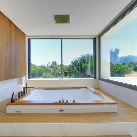 Soak in the jetted Jacuzzi tub and gaze out at the palm trees