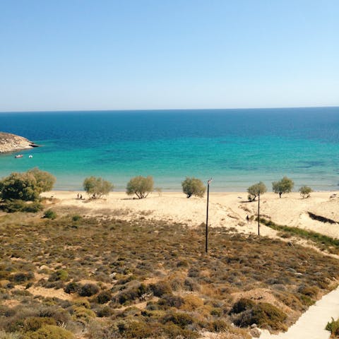Sink your feet into the golden sands of Tis Grias To Pidima beach