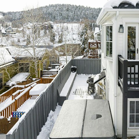 Take in the views of the tree-covered slopes from this Utah home