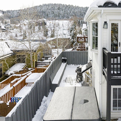 Take in the views of the tree-covered slopes from this Utah home