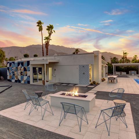 Bask in the warm glow of the fire pit and have fun in the games area