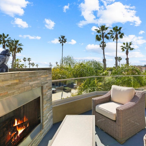 Watch the sunset from the rooftop deck beside the gas fireplace