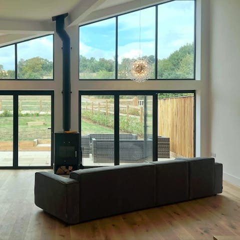 Curl up on the sofa in front of the cosy fireplace