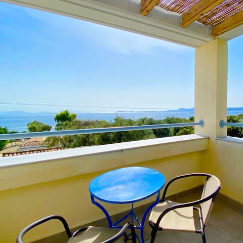 Dine alfresco on your private terrace and watch the sun dip into the sea in the distance