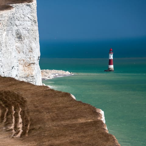 Enjoy breathtaking coastal walks at Beachy Head, a little over half an hour away