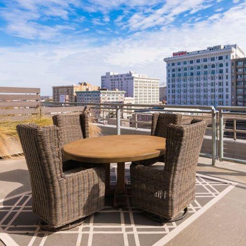 Have your morning coffee on the communal roof terrace, with the panorama of the city before you