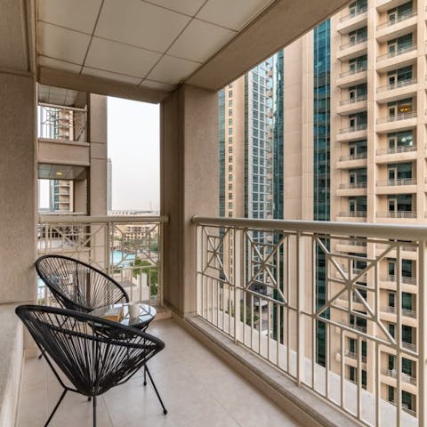 Savour your morning coffee on the balcony, perched against the railings to appreciate the city scenery