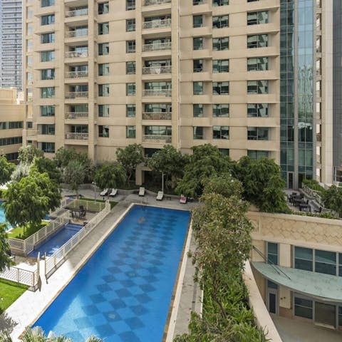 Soak up the sun beside the swimming pool, taking in the cityscape view, taking dips to cool off