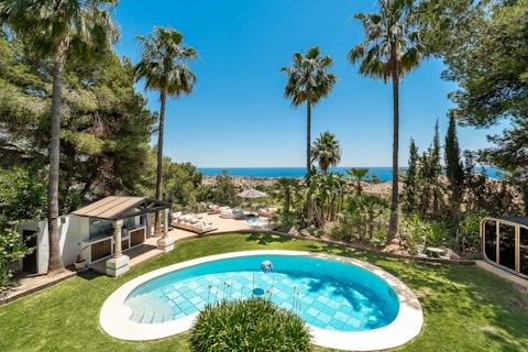 Bob about in the pool while admiring views of the Mediterranean