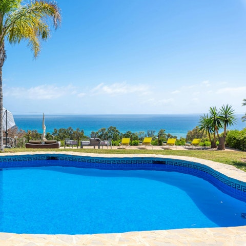 Enjoy views of the Mediterranean Sea as you swim in the pool