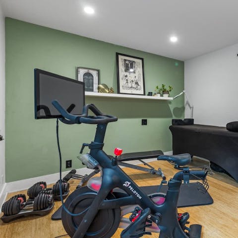 Keep fit with daily workouts in the gym, complete with Peloton bike