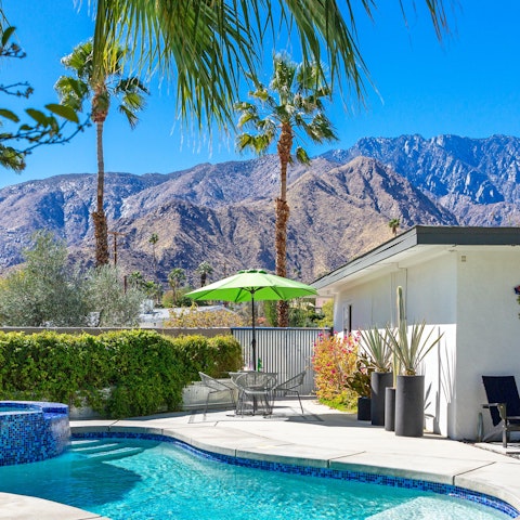 Spend sunshine days swimming with a mountainside view