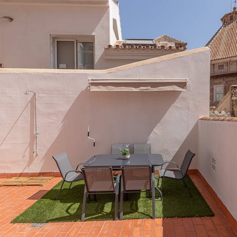 Enjoy an afternoon glass of sangria in the sun on the terrace