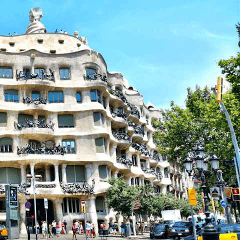 Admire the architecture on Passeig de Gràcia – a fourteen–minute walk away