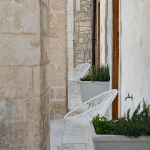 Sip vino on the private balcony overlooking the square below