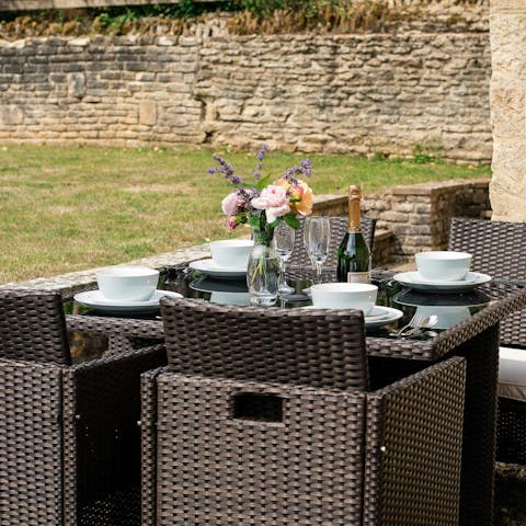 Dine alfresco in the garden, surrounded by roses and rolling fields