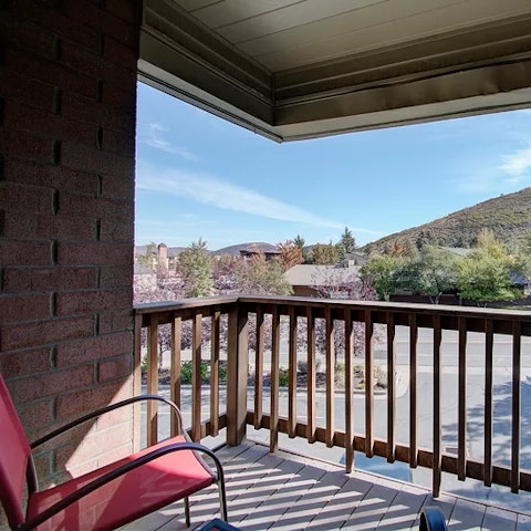 Enjoy a spot on the balcony overlooking the mountains