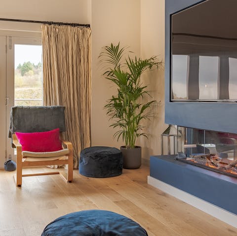 Warm up in front of the modern fireplace in the comfortable living room