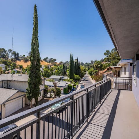 Start your mornings with coffee and leafy hillside views from the balcony