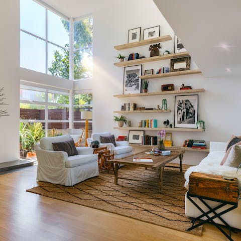 Flick through a coffee table book beneath the 20-foot ceilings