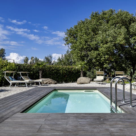 Stretch out by the pool surrounded by peaceful countryside