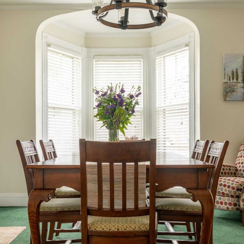 Enjoy meals and drinks around the antique dining table