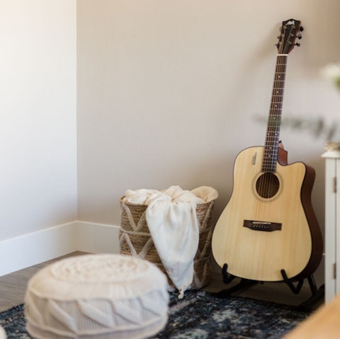 Entertain friends by strumming away on the guitar