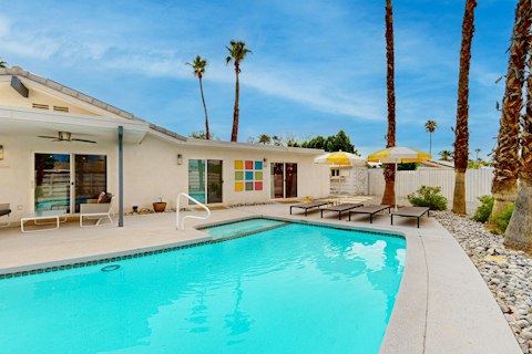 Cool off in the pool beneath swaying palms