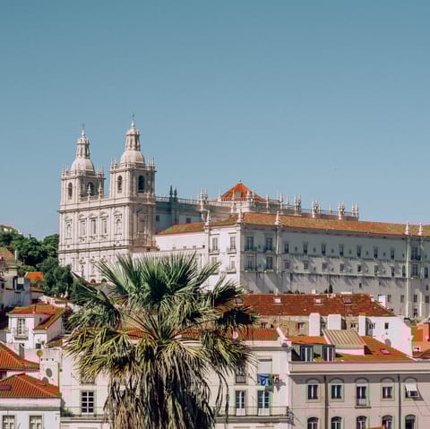 Explore the historic Alfama district and São Jorge Castle, a fifteen-minute walk away