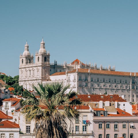 Explore the historic Alfama district and São Jorge Castle, a fifteen-minute walk away