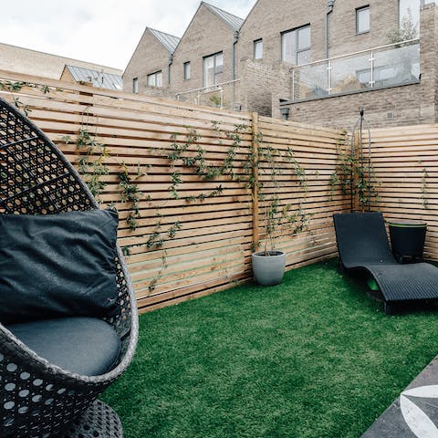 Kick back in the ground floor garden with a good book in hand