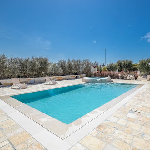 Jump in the shared pool and dry off on a sun lounger