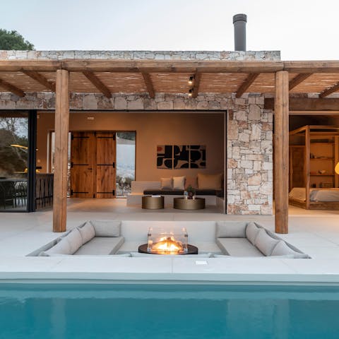 Gather together around the firepit on late summer evenings 