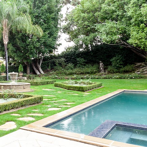 Treat yourself to a dip in the pool with in-built spa out in the manicured gardens