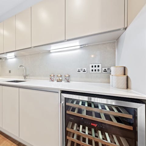 Select a bottle of English wine from the cooler before preparing dinner
