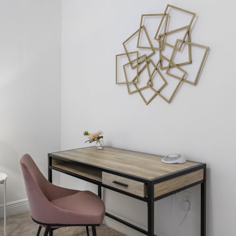 Catch up on emails at the writing desk, with super fast Wi-Fi