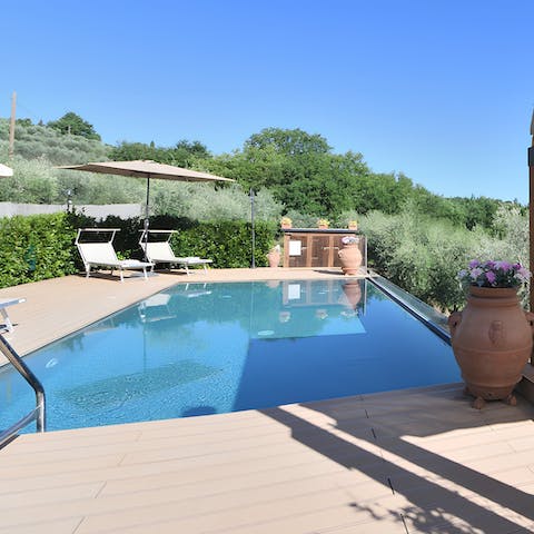 Enjoy a rejuvenating swim in the private outdoor pool