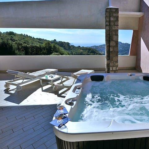 Pour yourself a spritz and relax in the hot tub