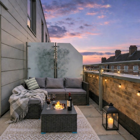 Enjoy sunset drinks by the firepit on the balcony