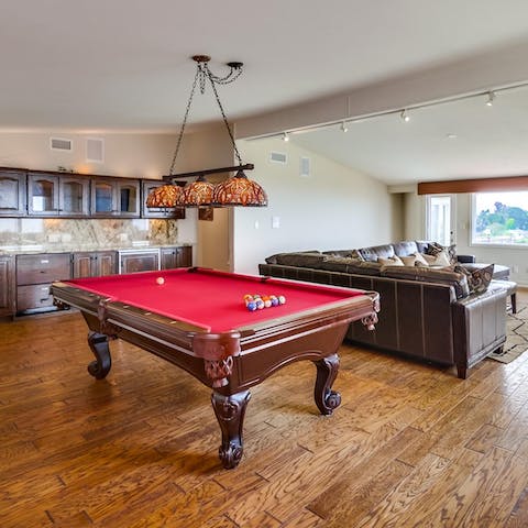 Get competitive over a game of pool in the games room