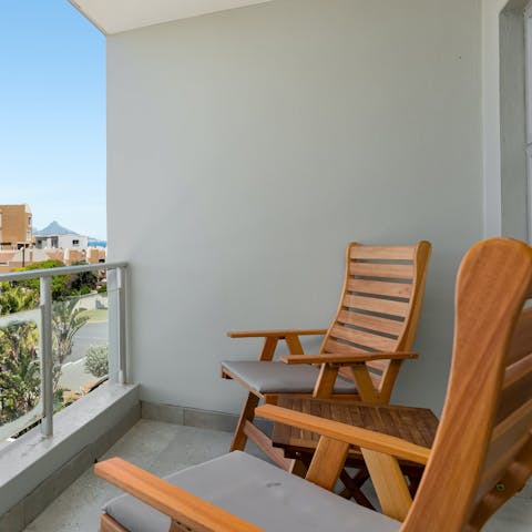 Sip sundowners on the private balcony as you unwind for the day