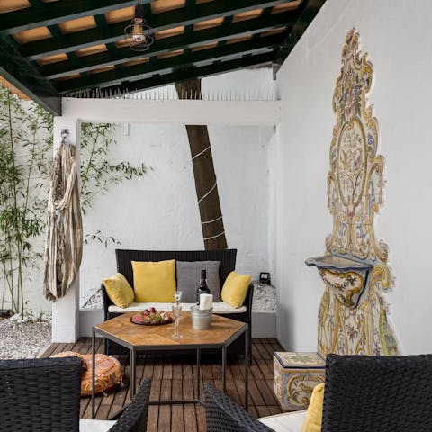 Relax in the outdoor lounge next to the old fountain