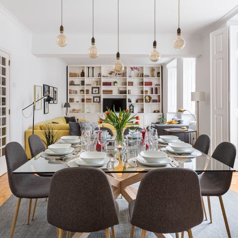 Gather around the glass dining table for a lavish meal