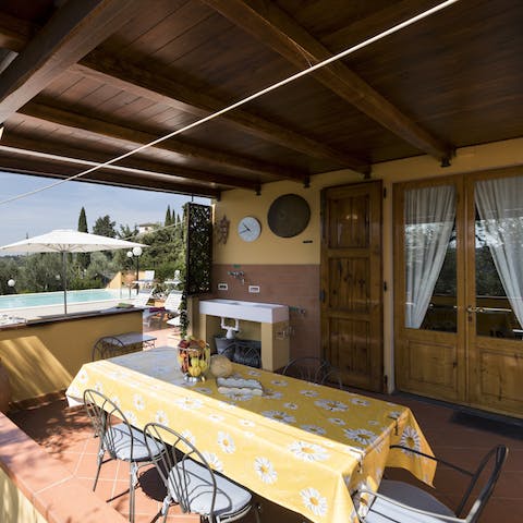 Watch the sunset while you share a toast with a glass of Prosecco on the covered terrace